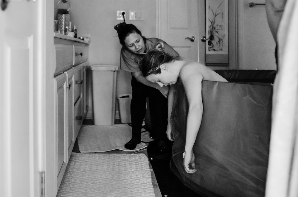 Birth doula jobs include supporting pregnant families in a water birth at home or in the hospital